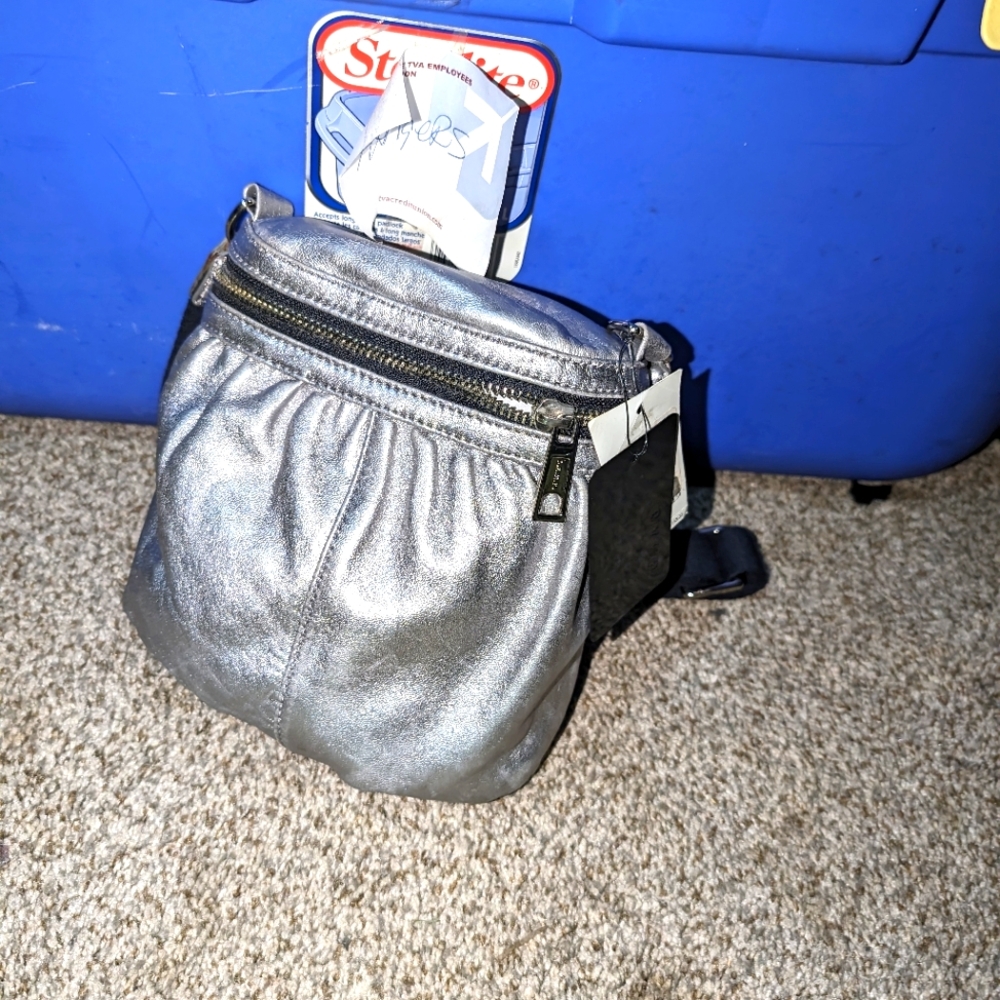 LAMB purse ,silver leather with black shoulder  strap.made by Gwen Stefani